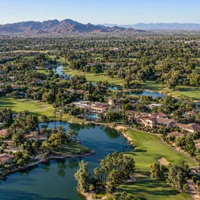 Aerial drone view of the Wigwam resort's golf courses and mature tree canopy in Litchfield Park, Arizona.